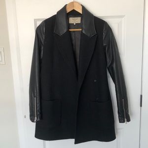 Black fitted coat with leather sleeves